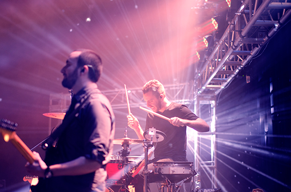 drummer and bassist performing in concert